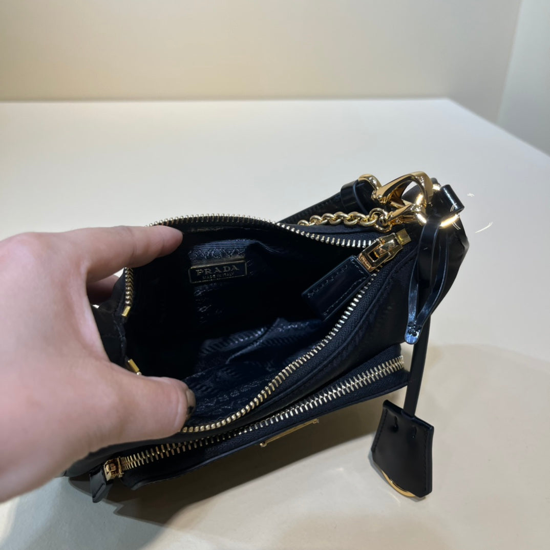 PRADA/ Recycled nylon and leather / Handbag/ Mini / Women's/ Black